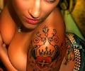 Indian girl with tattoos on her arm and back