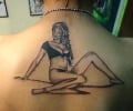 indian lady showing her upper back tattoo
