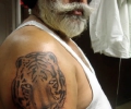 Sikh elder showing his 'sher' tattoo