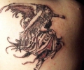 Angel on back tattoo