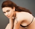 Actress showing her arm tattoo