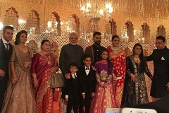 Posing with family and Narendra Modi