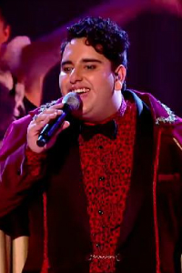 A spectacular performance by the 19-year-old Vikesh Champaneri has ushered him through to the semi-final of series 4 of The Voice UK.