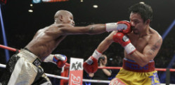 Floyd Mayweather defeats Manny Pacquiao in Las Vegas Fight of the Century