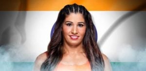 Kavita in front of Indian flag