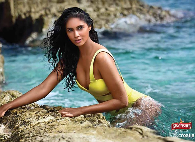Priyanka in a yellow swimsuit for Kingfisher Calendar 2018