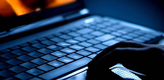 Man on laptop in the dark
