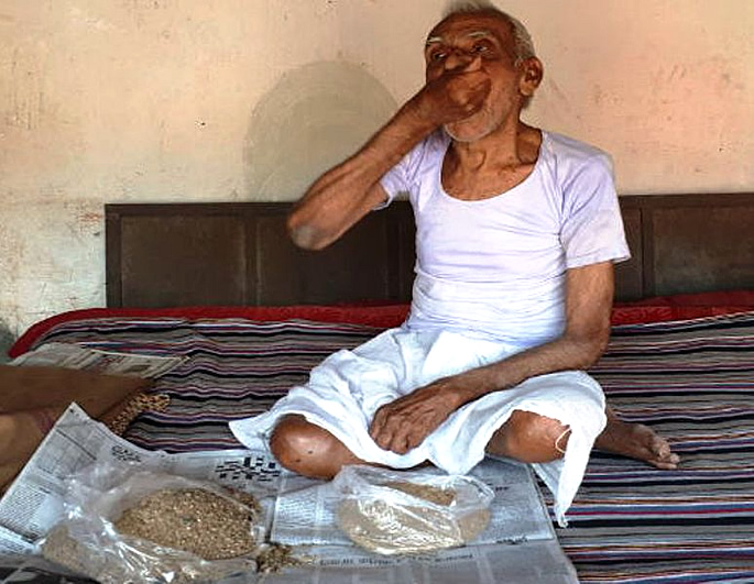 Ram Ikbal Choube eating sand