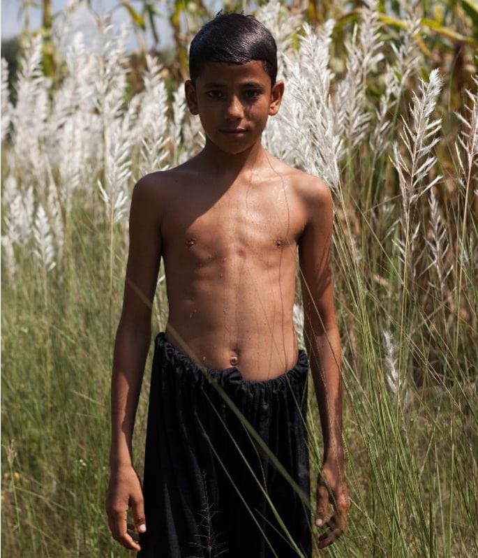 Mahtab-Hussain-Going-Back-Home-To-Where-I-Came-From-Boy-Portrait-Grass