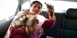Indian Aunty shows off Lots of Cash and Jewellery with a Gun f