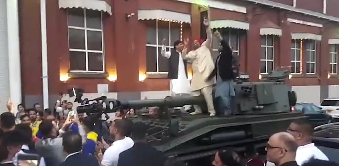 Big John's Groom arrives at Wedding in a Tank f