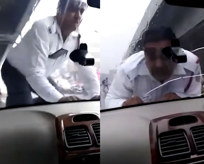 Indian Traffic Cop forcibly Driven on Car Bonnet for 2km - bonnet