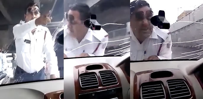 Indian Traffic Cop forcibly Driven on Car Bonnet for 2km f