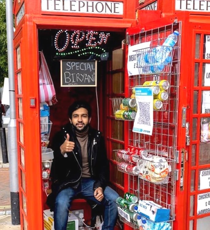 Man opens 'World's Smallest Takeaway' from red Phone Box