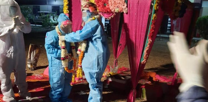 Indian Couple wed in full PPE after bride contracts Covid-19 f