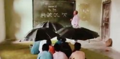 Students hold Umbrellas as Roof Leaks in Madhya Pradesh School