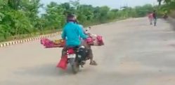 Indian Man takes Mother’s Body on bike for Cremation - f