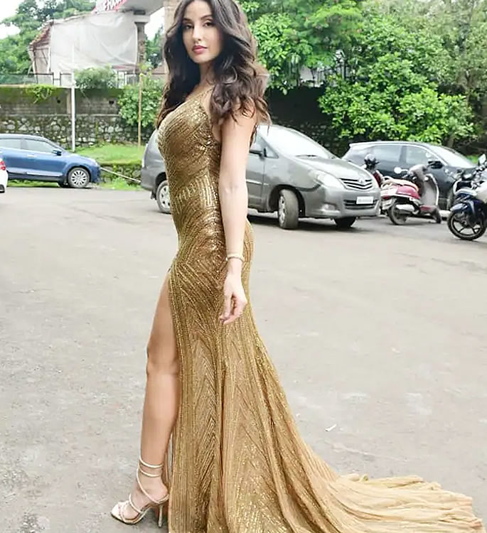 Nora Fatehi shimmers in Figure-Hugging Gold Gown