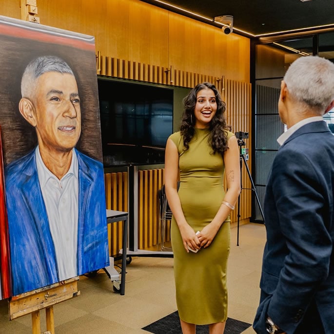 Art Student presents Portrait to Sadiq Khan